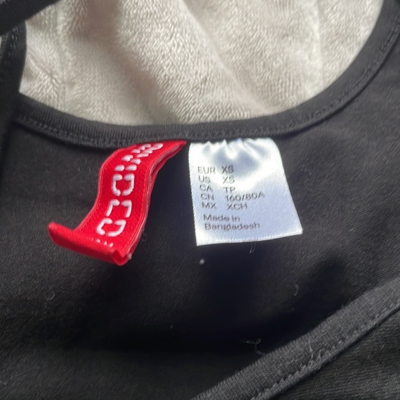 Divided little black mini dress, cotton material. Fits size XS. - Picture 2 of 2